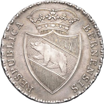 a close up of a silver coin with a bear on it