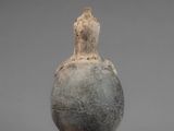 an image of a vase with a bird on top of it