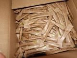 a cardboard box filled with a lot of packets of food