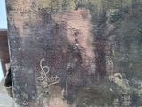 an image of a painting of a man with a beard on a wooden surface
