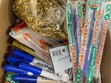 a cardboard box filled with different types of toothbrushes and toothpaste