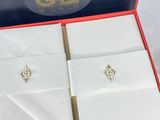 a red box with a pair of earrings in it