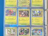 a close up of a binder with a bunch of pokemon cards on it