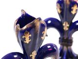 two blue vases with gold fleurons on them