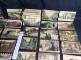 several old black and white photographs of old buildings on a table