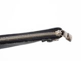 a close up of a zipper on a black purse