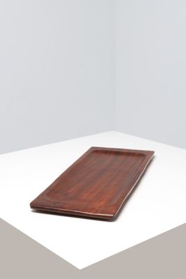 the tray is made out of wood and has a wooden edge