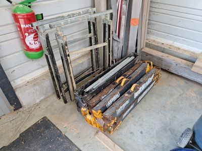 a pile of old wood and metal items in a garage