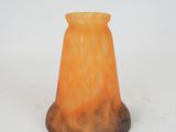 a small glass vase that is sitting on a table