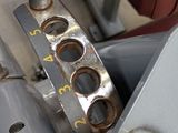 a close up of a machine with a seat in the background