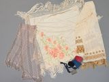 a lot of clothing that is laying out on a table