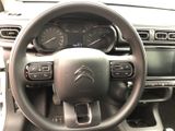 the interior of a car with a steering wheel and dashboard controls