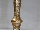 brass plated table lamp with a glass shade on top of it