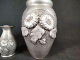 two vases that are sitting next to each other