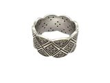 a close up of a silver ring on a white background