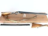 an old rifle with a wooden case on a white background
