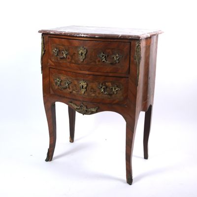 an antique chest of drawers with a marble top on a white background