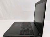the back of a black laptop computer sitting on top of a white table