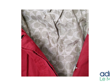 a picture of a red jacket with a grey and white pattern