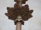 a close up of a metal pole with a clock on it