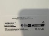 the back of a white box with a picture of a person holding a cell phone