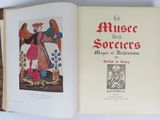 an open book with a picture of a woman holding a bird