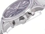 a close up of a watch on a white surface