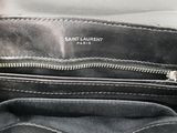 the inside of a black purse with a zipper on it