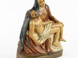 an image of a statue of a woman holding a child