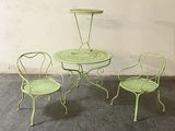 three chairs and a table on the concrete floor