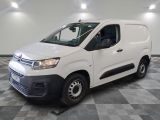 the white van is parked on a checkered floor in a room