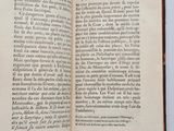 an open book on a table with a white background