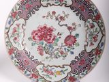 two plates that have flowers on them on them