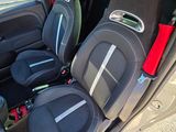 the back seats of a car with black seats and red trims