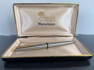 a pen sitting in a box on a table