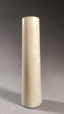 a white vase that is sitting on a table