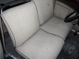 an image of a car with a seat up and a steering wheel