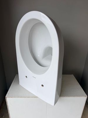 a white urinal sitting on top of a white box