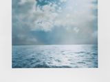 an image of a photograph of the ocean under a cloudy sky