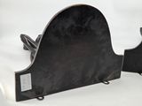 pair of black metal bookends on a white background