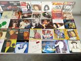 a table with a lot of different album covers on it