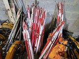 a pile of skis and ski poles sitting on the floor