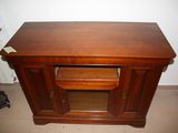 a wooden table with a drawer on top of it