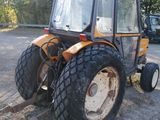 a tractor that is parked on the side of the road