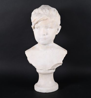 a white marble bust of a young boy with a turban on his head