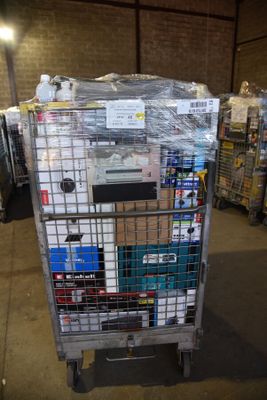 a cart with a lot of items on it in a warehouse