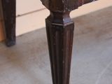 a close up view of a bed with a wooden frame