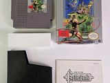 a game on the table next to a book and a video game