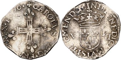 a silver coin with a cross on the front and a crown on the back
