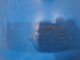 a close up of a blue metal object with a tag on it